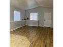Bright living room featuring hardwood floors, neutral paint, and plenty of natural light from the two windows at 4580 W Alameda Ave, Denver, CO 80219