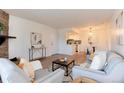 Open-concept living room with a view of the kitchen and dining area at 8335 Fairmount Dr # 7-208, Denver, CO 80247