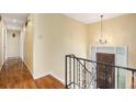 Foyer with hardwood floors, chandelier, and staircase at 2743 S Reading Ct, Denver, CO 80231