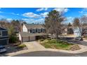 Beautiful home with mature trees, well-maintained lawn, a two-car garage, and a welcoming curb appeal at 10200 Julian St, Westminster, CO 80031