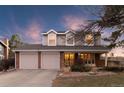 Charming two-story home with a two-car garage and inviting front porch, blending traditional design with modern comfort at 10200 Julian St, Westminster, CO 80031