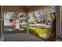 Cozy covered porch providing a shaded outdoor space with views of the surrounding neighborhood at 10200 Julian St, Westminster, CO 80031