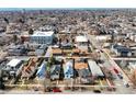 Charming neighborhood aerial view with diverse architecture and mountain backdrop at 3643 Shoshone St, Denver, CO 80211