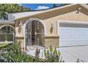 Close-up of an arched doorway with intricate metalwork and brick accents at 8220 Lamar Cir, Arvada, CO 80003