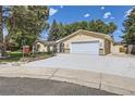 Beautiful one story house with a wide driveway and well-maintained landscaping at 8220 Lamar Cir, Arvada, CO 80003