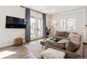 Cozy living room boasting a comfortable couch, natural light, and stylish decor at 4180 Kalamath St, Denver, CO 80211
