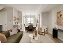 Spacious open concept living room with hardwood floors, modern furnishings, and natural light at 8260 E 36Th Ave # 30, Denver, CO 80238