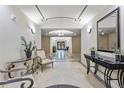 Elegant hallway with decorative tile flooring, high ceilings, stylish furnishings, and sophisticated lighting creates a grand entrance at 2500 E Cherry Creek South Dr # 313, Denver, CO 80209