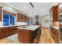 Spacious kitchen with a large center island, stainless steel appliances, and modern finishes at 10459 Rivington Ct, Lone Tree, CO 80124