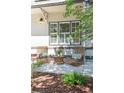 Inviting front porch with outdoor seating, perfect for relaxing and enjoying the neighborhood views at 623 S Logan St, Denver, CO 80209
