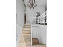 Elegant entryway with staircase and a chandelier at 19573 E Linvale Dr, Aurora, CO 80013