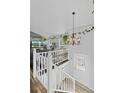 Bright entryway with staircase, chandelier, and hardwood floors at 19573 E Linvale Dr, Aurora, CO 80013