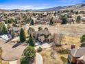 Expansive aerial view showcasing the home's location within a serene, picturesque community at 4 Prairie Falcon Ln, Littleton, CO 80127