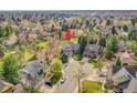 Aerial view showcasing the property's location in a lush, established neighborhood on a cul-de-sac at 6505 S Garfield Ct, Centennial, CO 80121