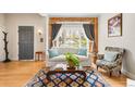 Inviting living room with hardwood floors, large windows, and comfortable seating at 2944 Hooker St, Denver, CO 80211