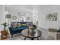 Cozy living room with bright decor, comfortable seating, and lots of natural light at 999 N Emerson St # 10, Denver, CO 80218