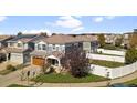 Aerial view of a lovely home with a spacious fenced yard and inviting curb appeal at 5555 Perth Ct, Denver, CO 80249