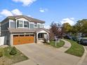 Beautiful two-story home with a two car garage and inviting curb appeal at 5555 Perth Ct, Denver, CO 80249