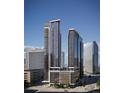 Striking exterior view showcases modern high-rise buildings and stunning architecture against a clear blue sky at 525 18Th St # 1205, Denver, CO 80202