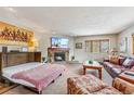 Open living area with a stone fireplace, sleeper sofa and comfortable seating at 290 Broken Lance Dr # B202, Breckenridge, CO 80424
