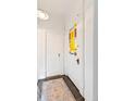 Bright entryway with decorative glass paneled door, molding detail and rug at 3429 W 34Th Ave, Denver, CO 80211