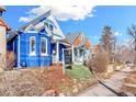 Street view of the home showing curb appeal, landscaping, and 