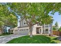 Well-maintained two-story home with a three-car garage and an inviting front yard at 6726 W 97Th Cir, Westminster, CO 80021