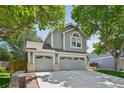 Charming two-story home with a three-car garage framed by mature, shady trees at 6726 W 97Th Cir, Westminster, CO 80021
