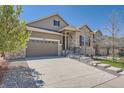 Beautiful two-story home featuring a well-maintained lawn and a spacious two-car garage at 7693 S Quantock Way, Aurora, CO 80016