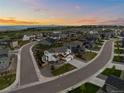 Gorgeous elevated view of a charming neighborhood and the beautiful, modern, two-story home at 6696 Kenzie Cir, Castle Pines, CO 80108