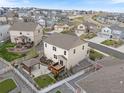 An aerial view shows the property, including a backyard gazebo, landscaping, and fencing at 5842 High Timber Cir, Castle Rock, CO 80104