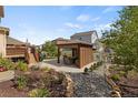 Beautiful backyard featuring a cozy gazebo, manicured landscaping and a charming patio area at 5842 High Timber Cir, Castle Rock, CO 80104