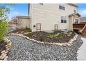 Beautiful landscaping featuring rocks and small shrubs, adjacent to the home's exterior at 5842 High Timber Cir, Castle Rock, CO 80104
