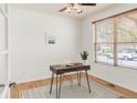 Well-lit office featuring a desk, chair, window with blinds, and a ceiling fan for added comfort at 6700 W Dorado Dr # 41, Littleton, CO 80123