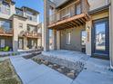 Modern townhome with private patio and well-maintained landscaping providing an inviting outdoor space at 10071 Belvedere Cir, Lone Tree, CO 80124