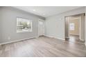 Cozy living room with natural light, fresh paint, and neutral flooring at 1270 S Tennyson St, Denver, CO 80219
