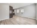 Bright living room with wood floors, fresh paint, and updated windows at 1270 S Tennyson St, Denver, CO 80219