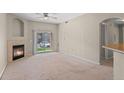 The living room includes sliding glass doors to the outside and a corner fireplace at 7440 S Blackhawk St # 104, Englewood, CO 80112