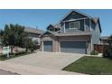 Charming two-story home with brick accents and a spacious three-car garage at 10144 Madison St, Thornton, CO 80229