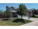Well-manicured lawn and mature trees frame this inviting home's exterior at 10144 Madison St, Thornton, CO 80229