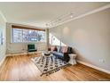 Bright living room with hardwood floors and ample natural light at 10 N Ogden St # 301, Denver, CO 80218