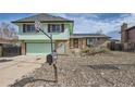 Two story home with basketball hoop, walkway to the front door, and drought-resistant landscaping at 16463 E Girard Ave, Aurora, CO 80013