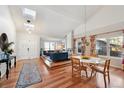 Light-filled entryway with hardwood floors and double doors at 11292 Main Range Trl, Littleton, CO 80127