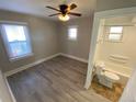 Cozy bedroom with ceiling fan and an en-suite bathroom at 504 Quitman St, Denver, CO 80204