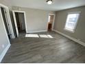 Bright living room featuring gray walls and wood-look floors at 504 Quitman St, Denver, CO 80204