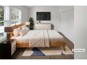 Cozy bedroom with a comfortable bed, minimalist decor, and ample natural light from the window at 7604 S Steele St, Centennial, CO 80122