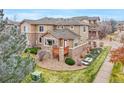 Townhome with backyard deck and surrounding landscape at 7616 S Sicily Way, Aurora, CO 80016