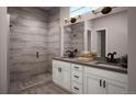 Contemporary bathroom featuring a double vanity, walk-in shower, and stylish fixtures at 1807 Grayside Cir, Castle Rock, CO 80109