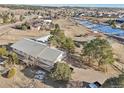 Aerial view of house, detached garage, and expansive lot at 9042 E Wagon Wheel Way, Parker, CO 80138