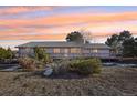 House with deck, showcasing a large backyard at 9042 E Wagon Wheel Way, Parker, CO 80138